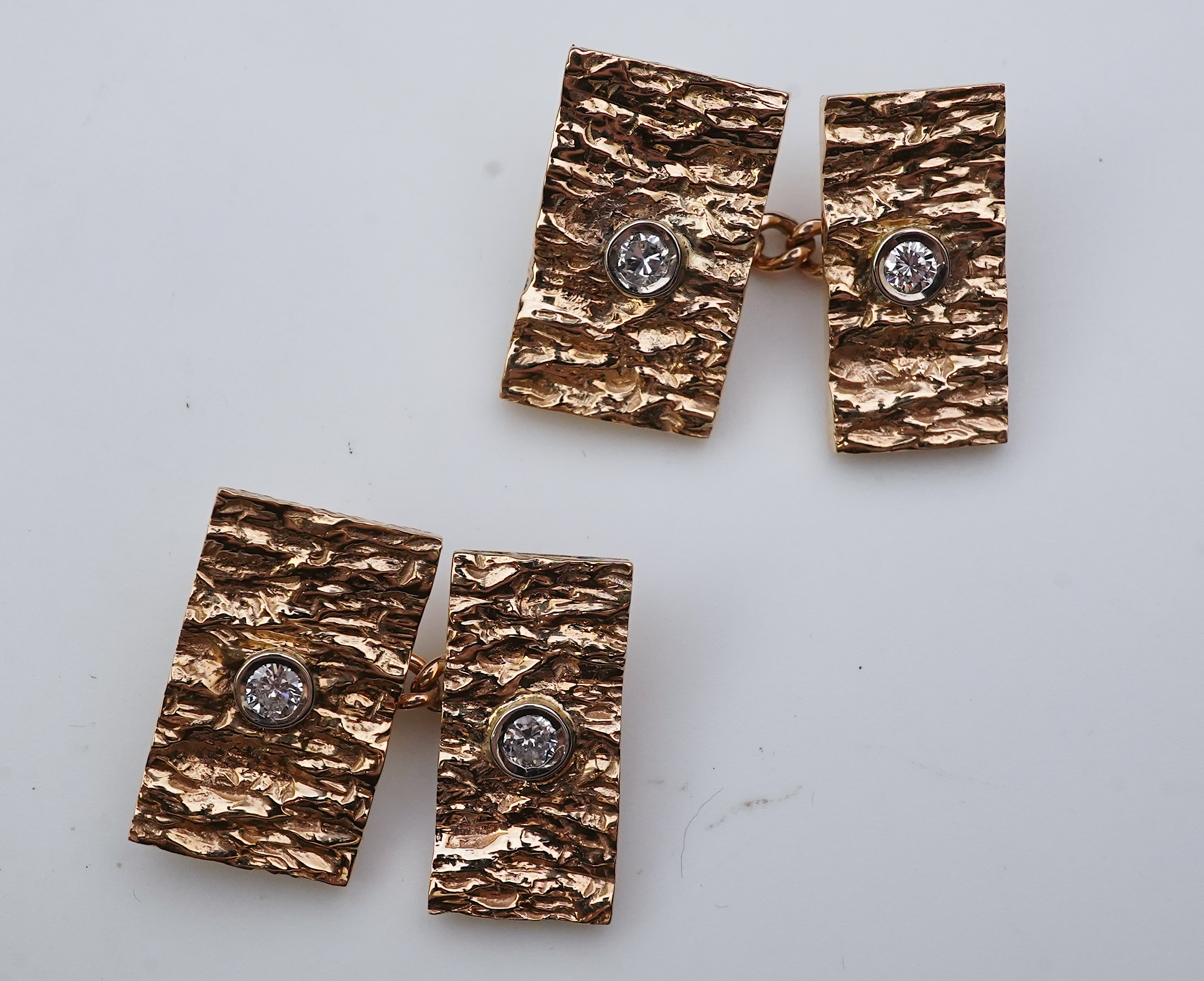 A pair of 9ct gold and diamond cufflinks, 1970s